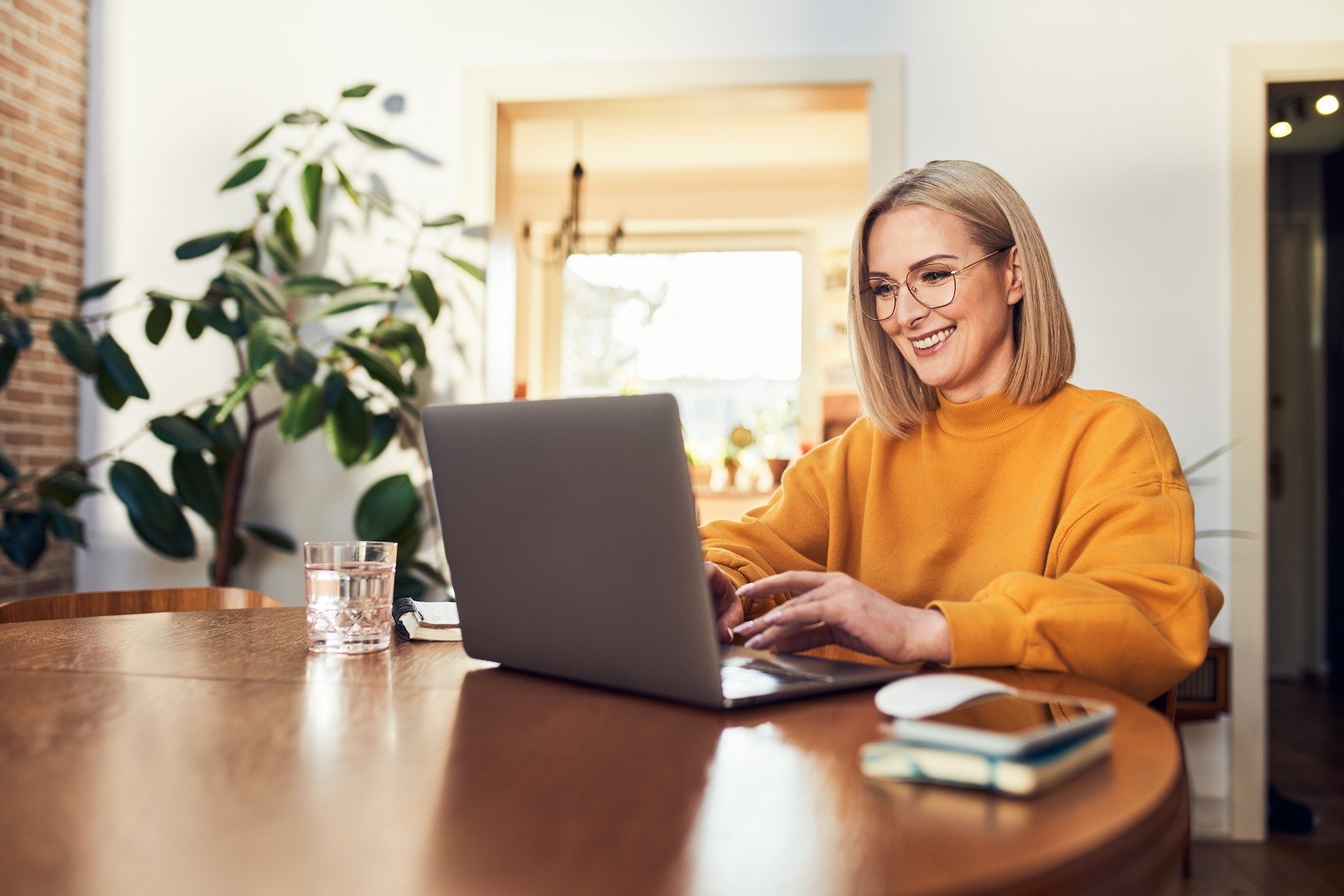 Woman watching webinar on laptop